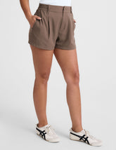 brown shorts with front pleats and side pockets.